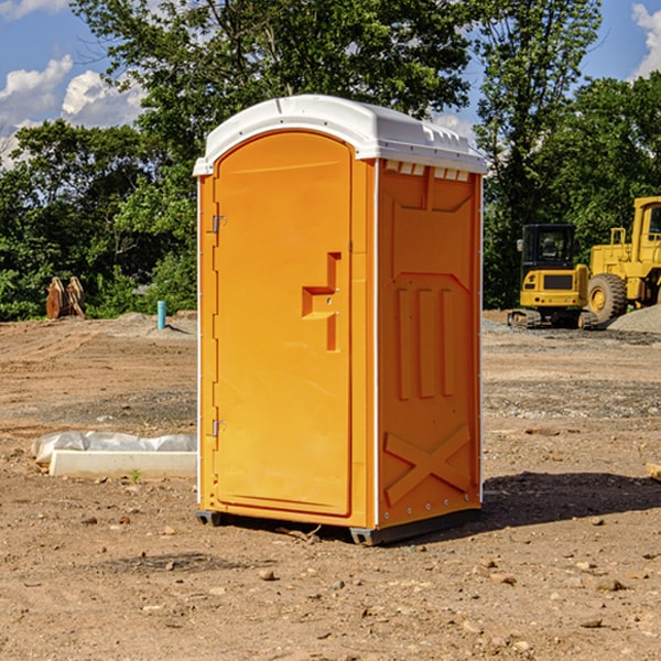 what is the cost difference between standard and deluxe porta potty rentals in East Williamson